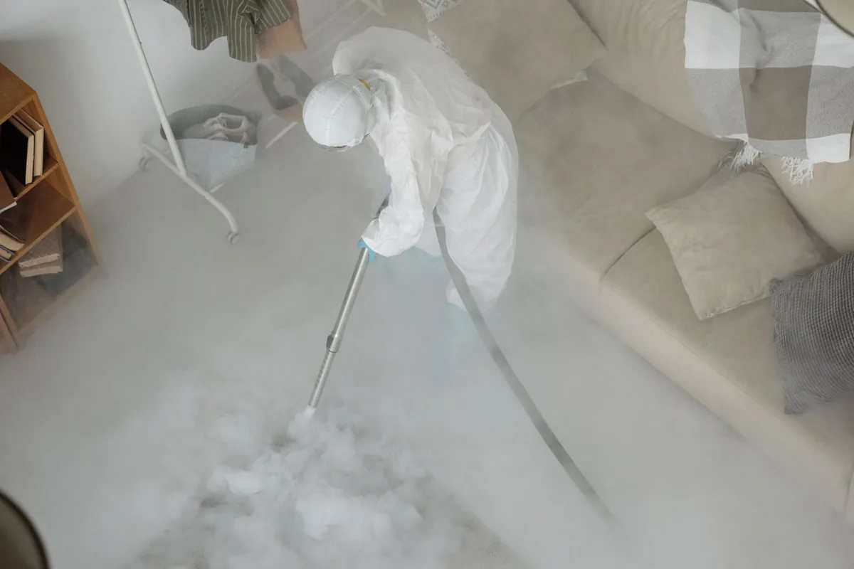 Biohazard cleanup technician in protective equipment, Eden Valley, MN